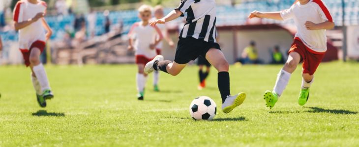 Kids playing a soccer game