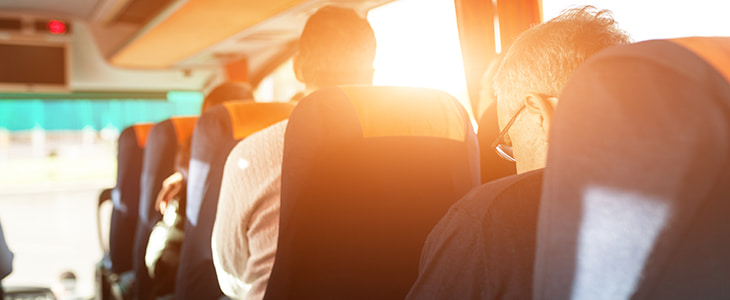 Interior of a premium charter bus full of passengers