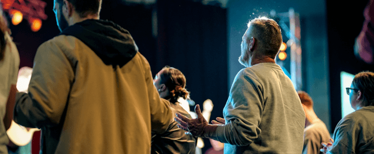 a group of people praying