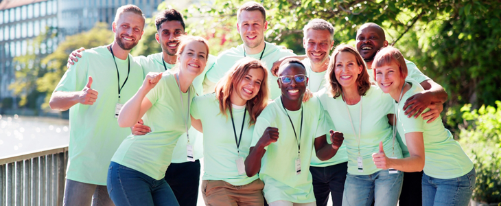 a group of volunteers smiling at the camera