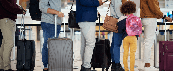 a group of people waiting at the airport