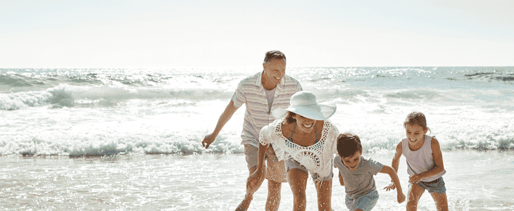 A family hugging and laughing together.