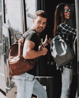 Two passengers approach a bus